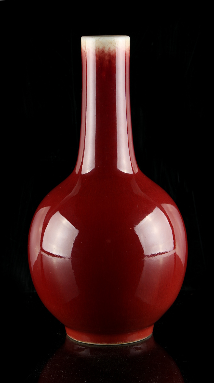 A Chinese flambe glazed bottle vase, 18th / 19th century, 9.5ins. (24.1cms.) high (see