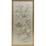 A large Chinese embroidered silk panel depicting birds & butterflies among flowering shrubs, late