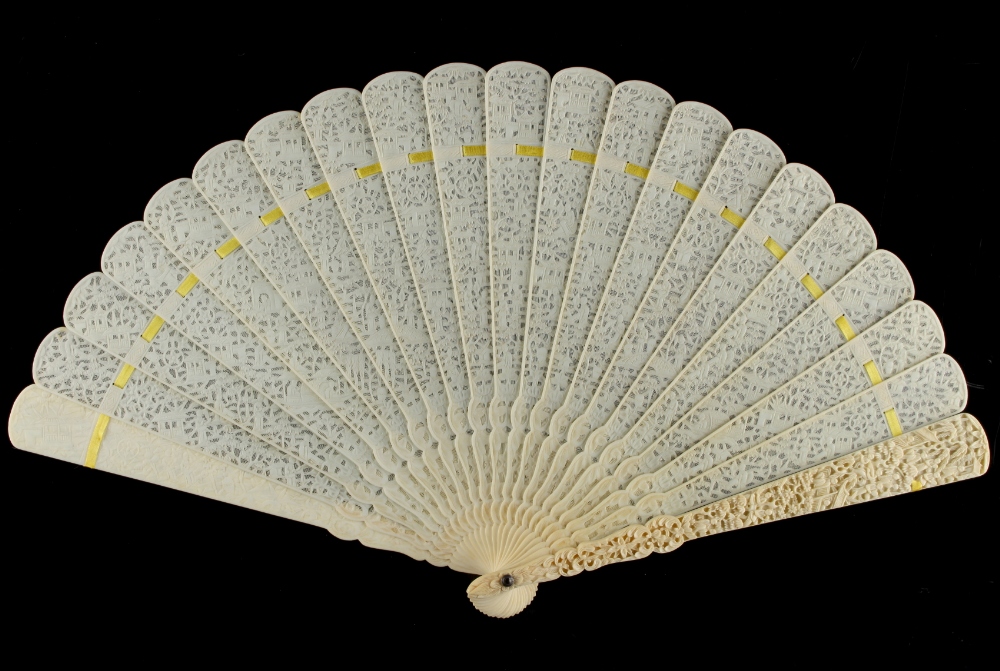 A Chinese Canton carved ivory fan, 19th century, 9.3ins. (23.6cms.) long (see illustration).