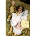 Property of a gentleman - a German EMCO bisque headed doll with sleeping eyes & jointed