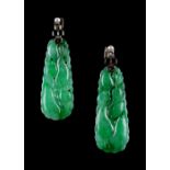 A pair of Chinese carved jadeite pendant earrings, the white metal mounts each set with a single