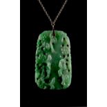 A Chinese carved & pierced jadeite rectangular pendant plaque, late 19th / early 20th century,