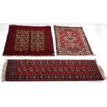 Property of a lady - an Afghan rug with burgundy ground, 52 by 44ins. (132 by 112cms.); together