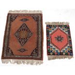 Property of a lady - an Afghan rug with light brown ground, 45 by 34ins. (114 by 86cms.); together
