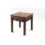 A Chinese hongmu square topped table, late 19th / early 20th century, with carved frieze & scroll