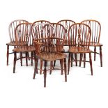 Property of a gentleman - a set of eight early 19th century yew wood Windsor chairs of good
