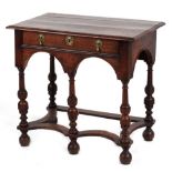 Property of a lady of title - an oak lowboy with turner baluster legs & shaped flat stretchers,