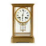 Property of a gentleman - a late 19th century French brass four glass clock, the numbered French 8-