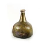 Property of a lady - a late 17th / early 18th century onion shaped wine bottle, with iridescence,