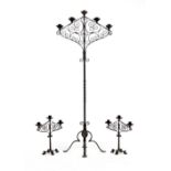 Property of a deceased estate - an ornate wrought iron floor standing five-light candelabrum;