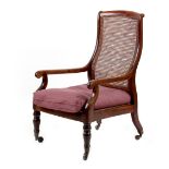 Property of a lady of title - a Victorian mahogany bergere armchair, with turned front legs &