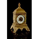 Property of a gentleman - a late 19th century ornate brass cased mantel clock timepiece with 8-day