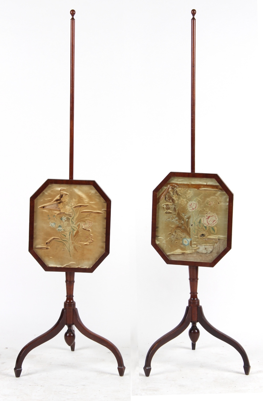 Property of a lady of title - a pair of mahogany tripod polescreens with floral embroidered silk