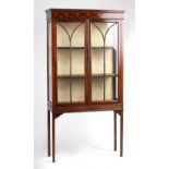 Property of a deceased estate - an Edwardian two-door china display cabinet with ribbon & bell