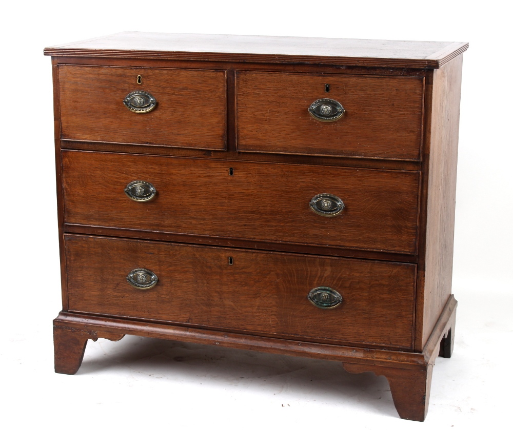 Property of a deceased estate - an early 19th century oak chest of two short & two long graduated