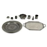 Property of a deceased estate - a group of nine pewter items including a large charger, 20.2ins. (