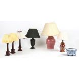 Property of a lady of title - three wooden table lamps with shades, each 19.75ins. (50cms.) high (