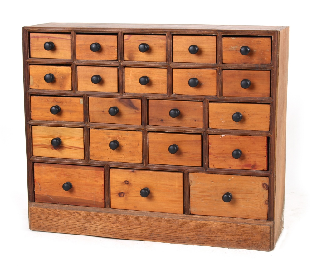 Property of a deceased estate - a pine bank of twenty-one drawers, the drawers of three different