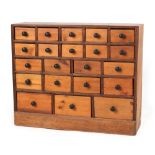 Property of a deceased estate - a pine bank of twenty-one drawers, the drawers of three different