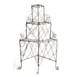 Property of a gentleman - a grey painted wirework three-tier corner flowerpot stand, late 19th /