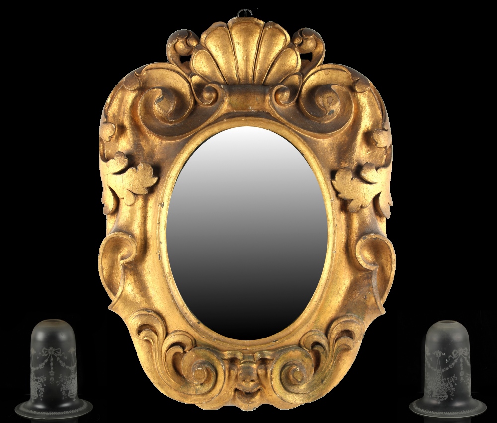 Property of a gentleman - a Victorian carved gilt framed wall mirror, 24ins. (61cms.) high; together