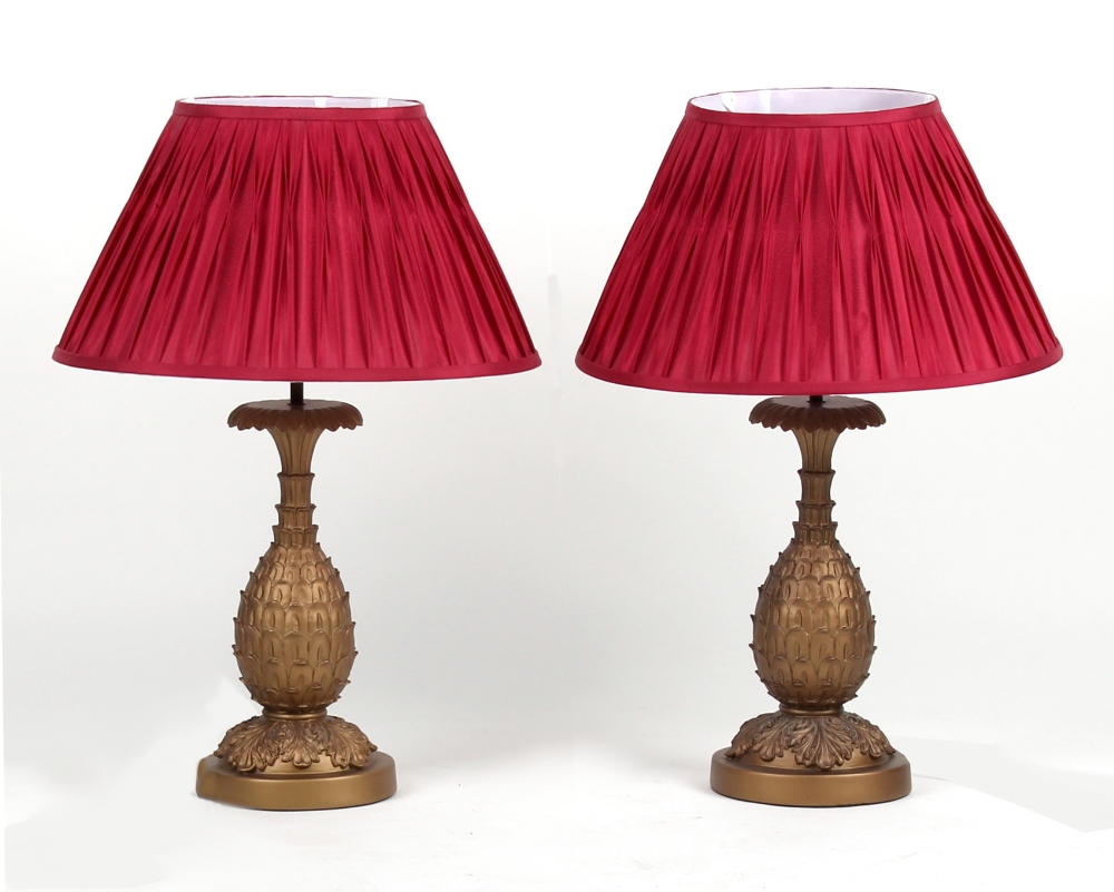 Property of a lady of title - a pair of gilt painted pineapple table lamps with shades, each