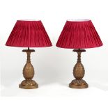 Property of a lady of title - a pair of gilt painted pineapple table lamps with shades, each