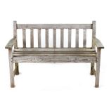 Property of a deceased estate - a teak garden bench, 50.25ins. (127.5cms.) long (see illustration).