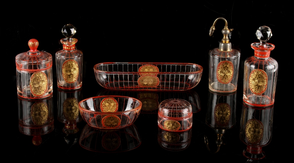 Property of a deceased estate - an Art Deco red & gilt decorated glass seven piece dressing table