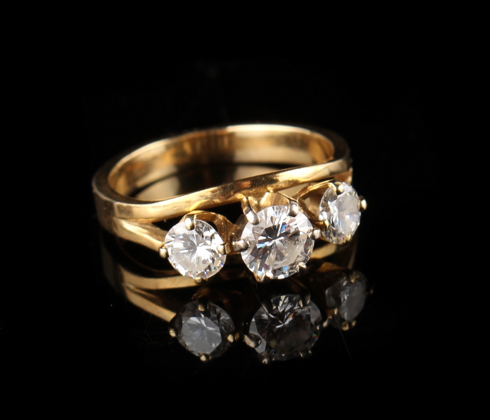 Property of a lady - a Dutch unmarked yellow gold (tests 14-18ct) diamond three stone ring, the