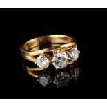 Property of a lady - a Dutch unmarked yellow gold (tests 14-18ct) diamond three stone ring, the