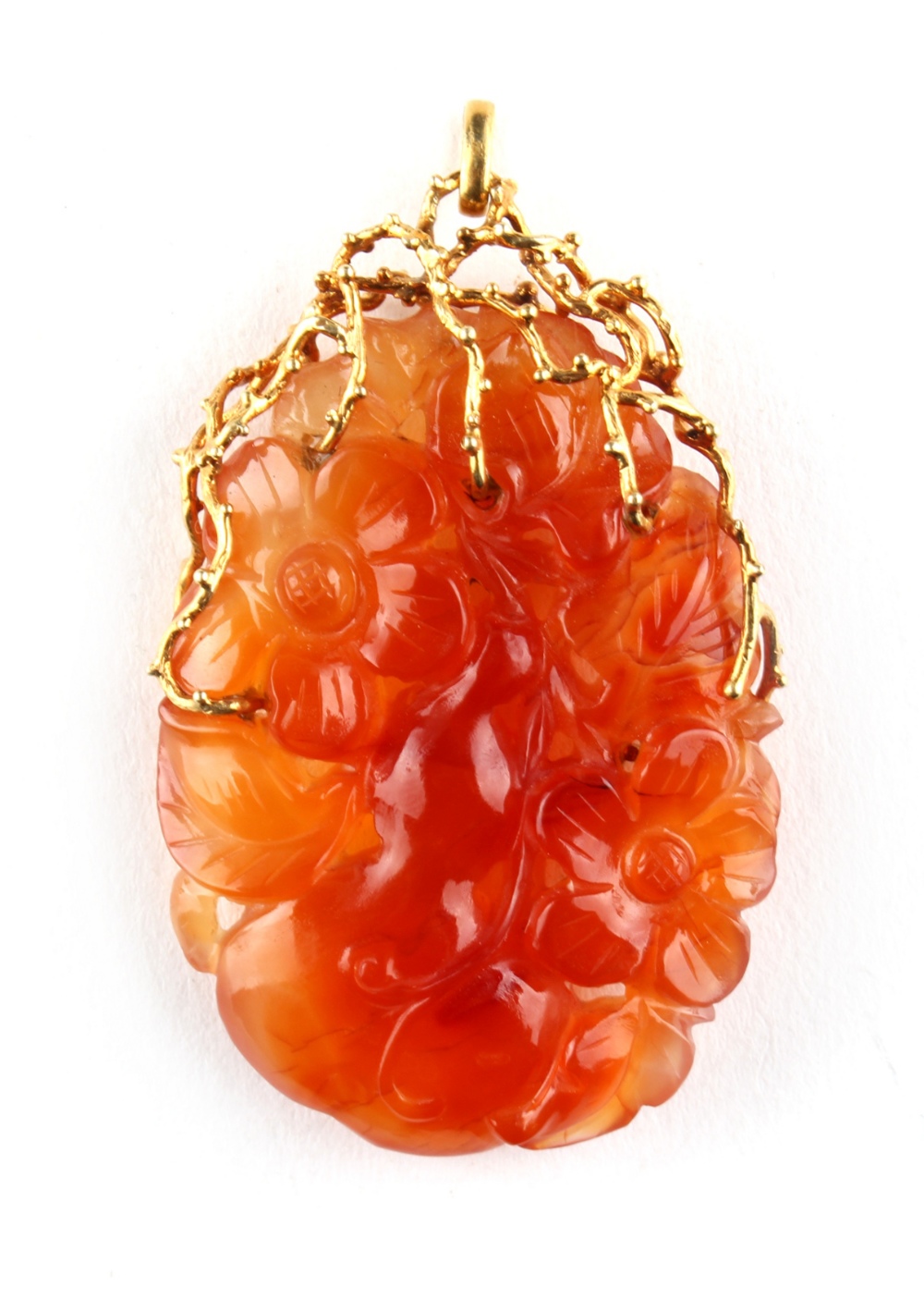 A large 14ct yellow gold mounted carved carnelian pendant modelled as a gourd & leaves, 2.45ins. (