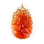 A large 14ct yellow gold mounted carved carnelian pendant modelled as a gourd & leaves, 2.45ins. (