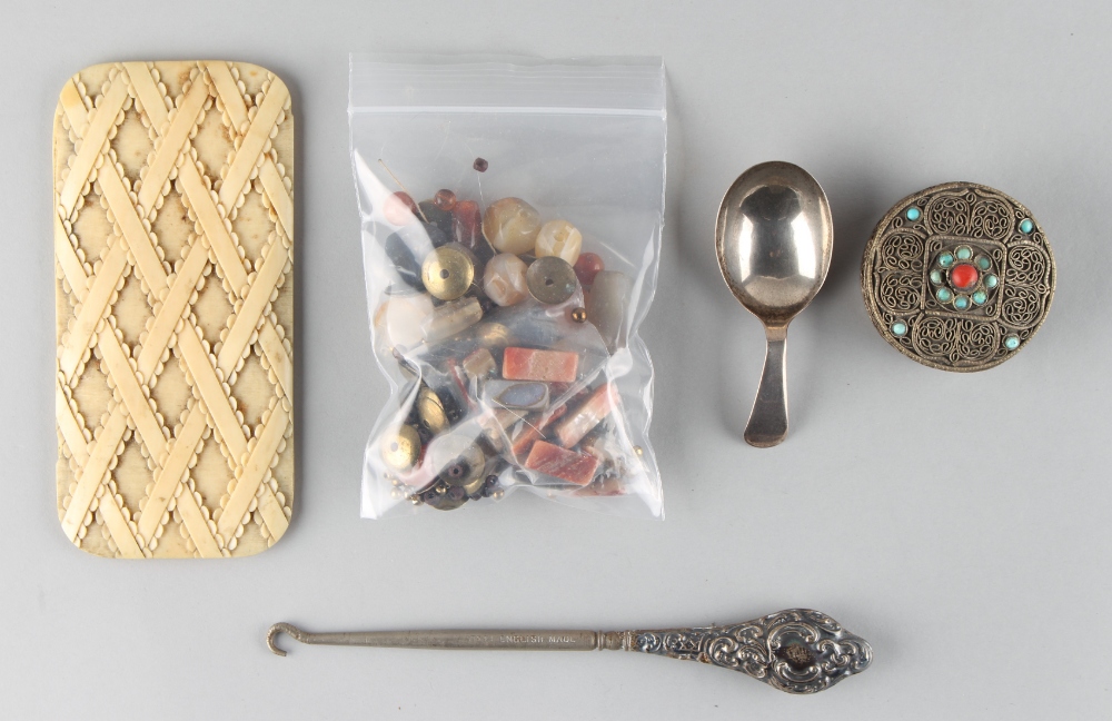 Property of a deceased estate - a bag containing assorted items including a Georgian silver caddy