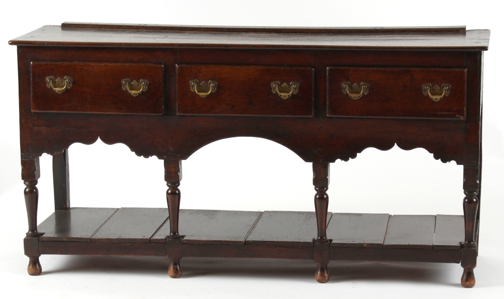 Property of a gentleman - a small 18th century oak Welsh dresser base, with three drawers above a