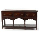 Property of a gentleman - a small 18th century oak Welsh dresser base, with three drawers above a