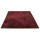 Property of a lady - a Turkoman design carpet with four rows of octagonal guls on a burgundy ground,