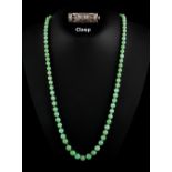 A jadeite graduated bead necklace, with apple green inclusions, the beads ranging from 5.36 to 9.