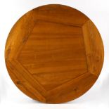 A Continental chestnut circular dining table top, 62.25ins. (158cms.) diameter (see illustration).