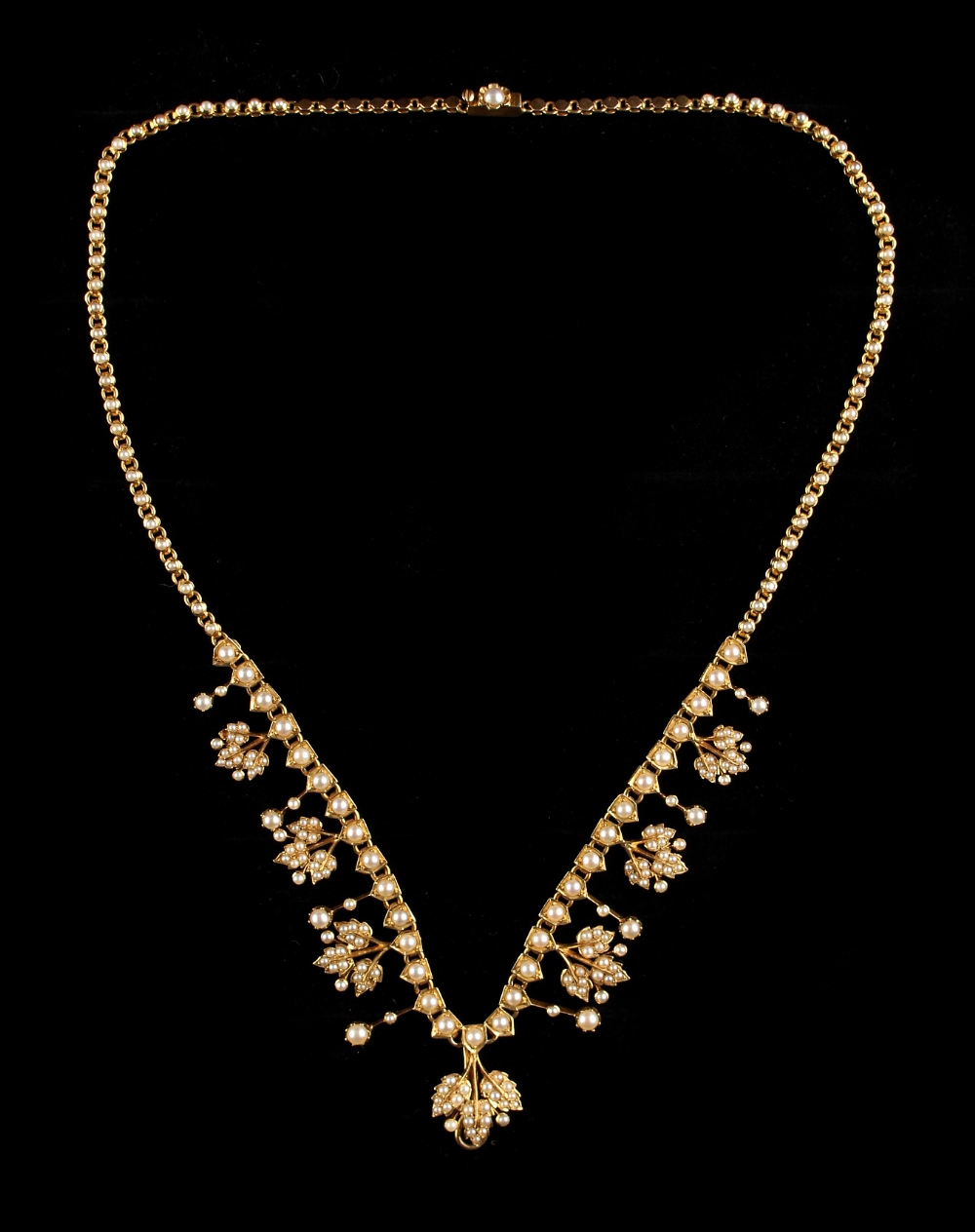 A Victorian unmarked yellow gold (tests 14-18ct) seed pearl necklace, with pearl set links & pearl