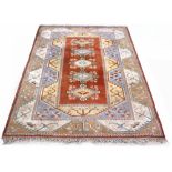 Property of a lady - a Turkish Kazak style rug with pale ground, 117 by 79ins. (297 by 211cms.) (see