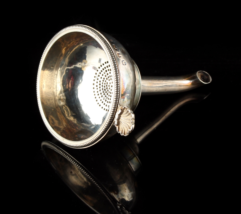 Property of a lady - a George III silver three part wine funnel, with shell handle, London 1771, 4.