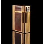 Property of a lady - a S J Dupont gold plated amber 'Laque de Chine' lighter, with diamond set