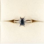 Property of a lady - an 18ct white gold oval cut sapphire & diamond ring, with pierced shoulders,