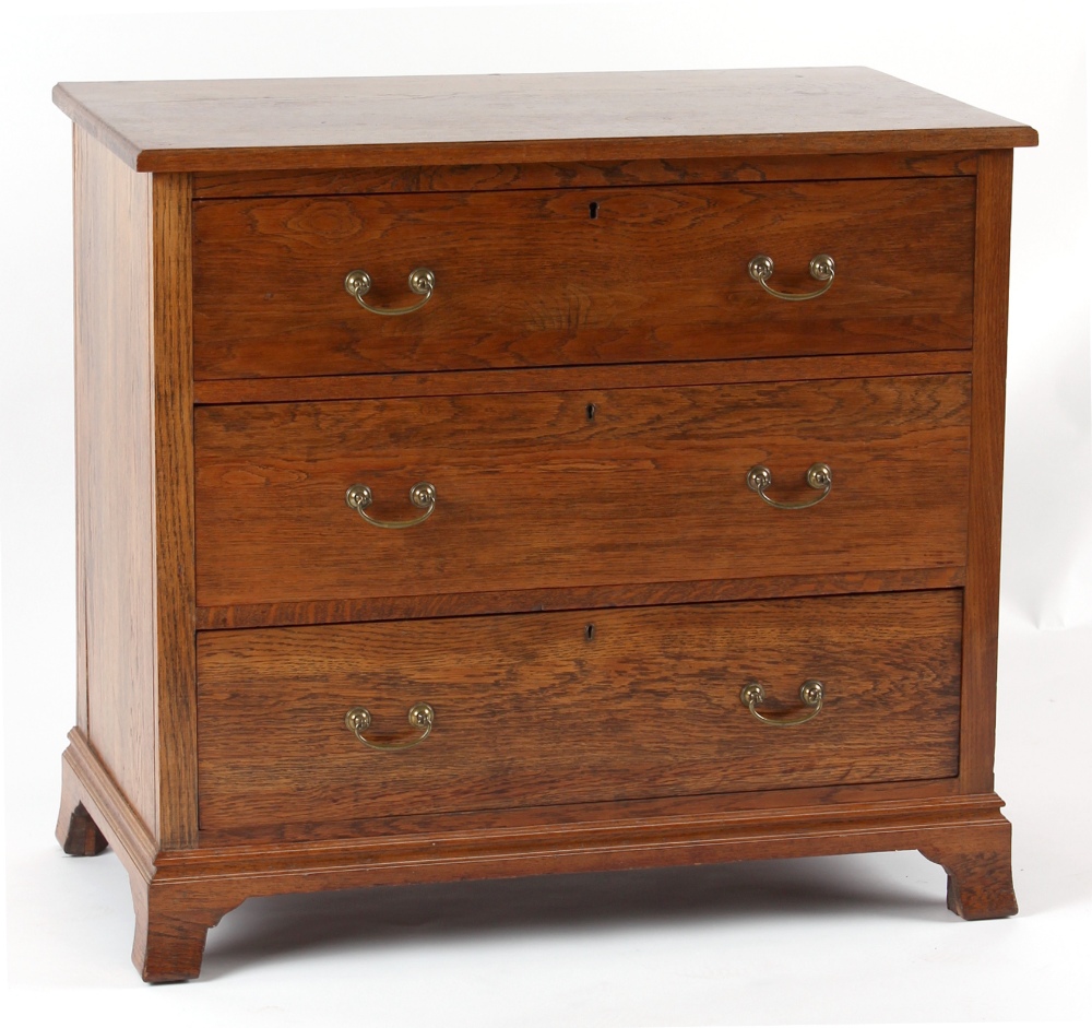 Property of a gentleman - an Edwardian oak dressing chest base, with three long drawers, on swept