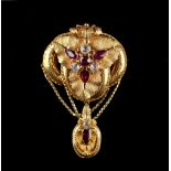 A Victorian yellow metal almandine garnet & clear 'stone' brooch, circa 1860, 2.35ins. (6cms.)