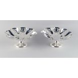 Property of a lady - a pair of George V silver pedestal bonbon dishes, with pierced decorations,