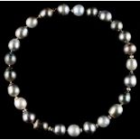A Tahitian pearl necklace, the twenty-five irregular shaped variegated grey pearls each