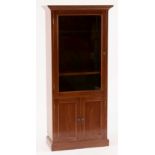 Property of a gentleman - a reproduction oak glazed single door display cabinet with two-door