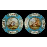 Property of a deceased estate - a pair of Sevres style bleu celeste plates, each painted with a